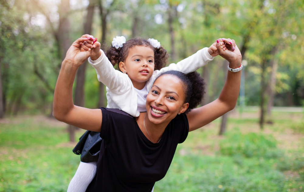 Young mother and daughter in a park